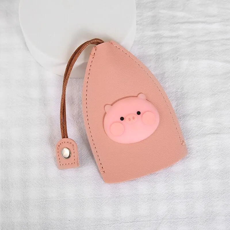 Cartoon pull-out key case in PU leather showing pull-out mechanism and colourful design options