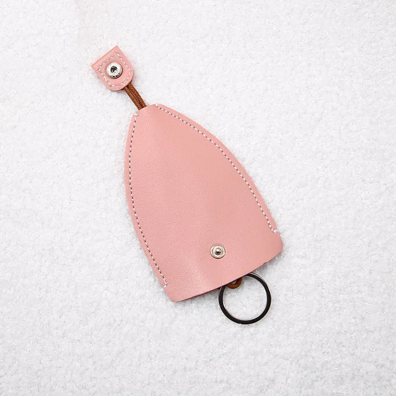 Cartoon pull-out key case in PU leather showing pull-out mechanism and colourful design options