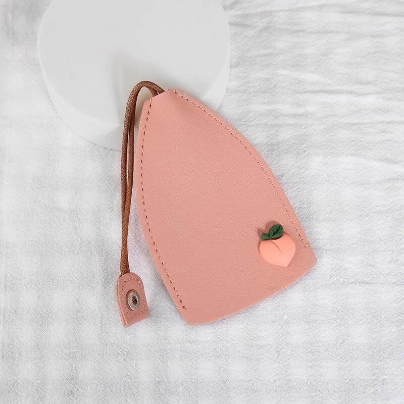 Cartoon pull-out key case in PU leather showing pull-out mechanism and colourful design options