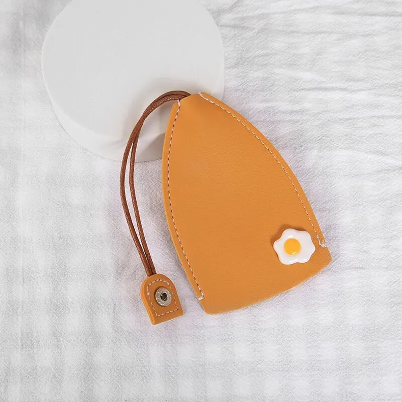 Cartoon pull-out key case in PU leather showing pull-out mechanism and colourful design options