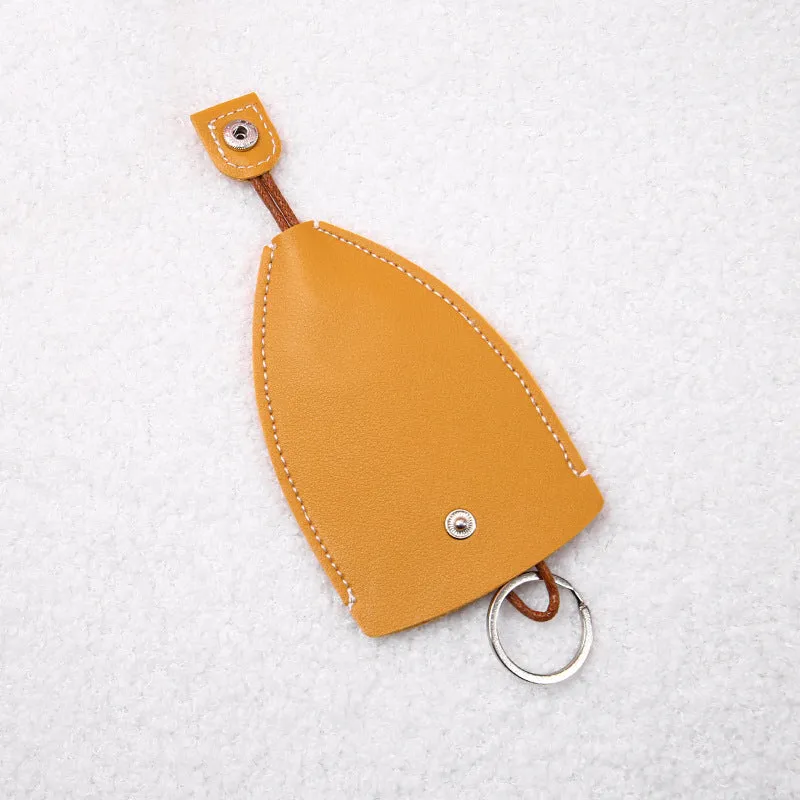 Cartoon pull-out key case in PU leather showing pull-out mechanism and colourful design options