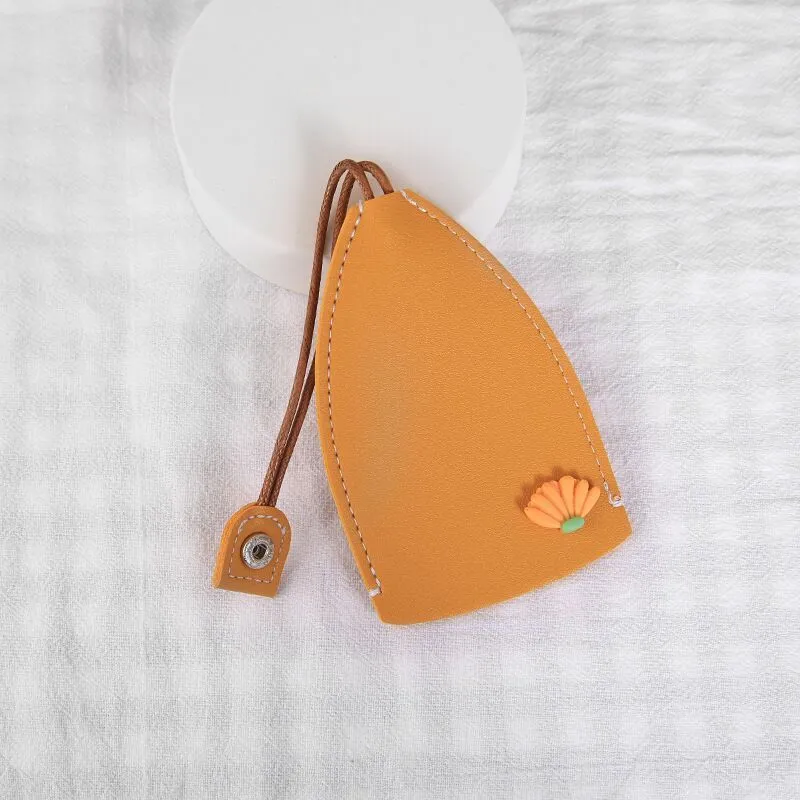 Cartoon pull-out key case in PU leather showing pull-out mechanism and colourful design options