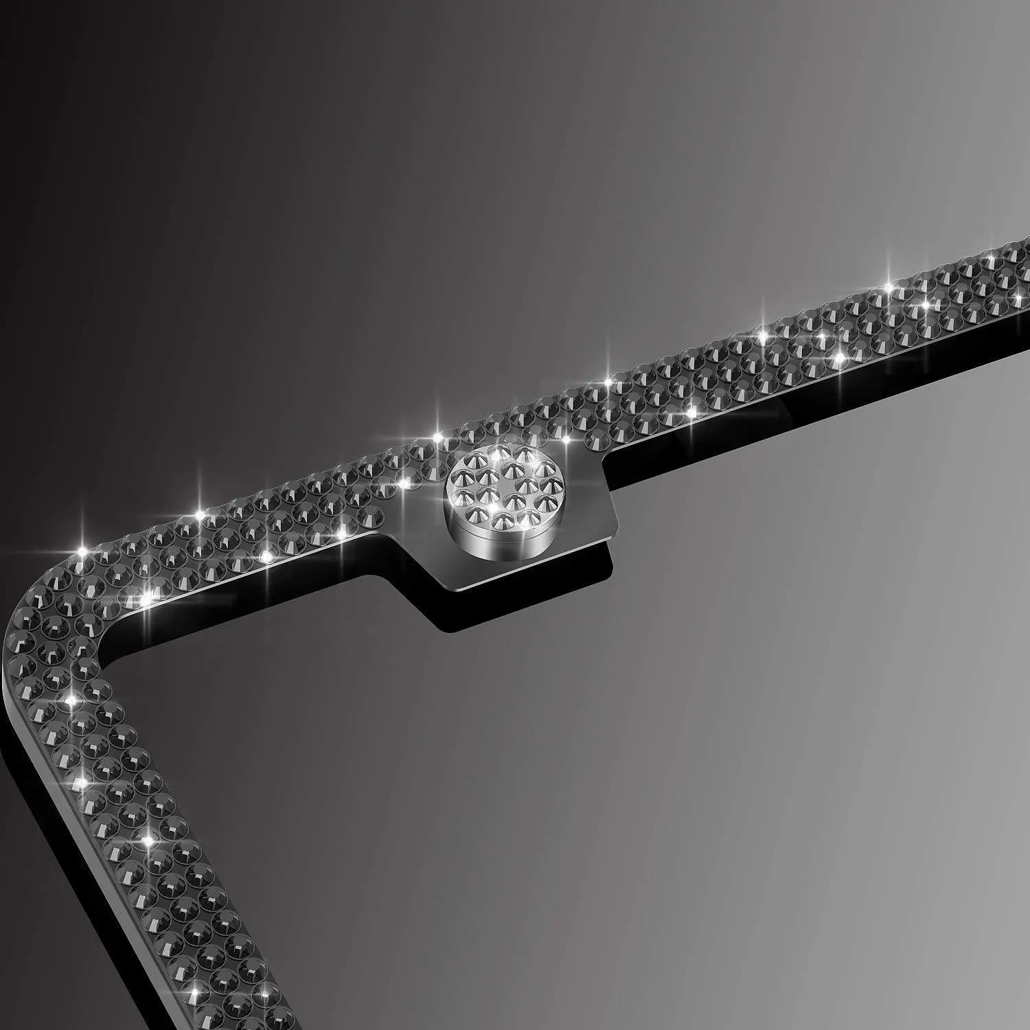 White diamond-studded stainless steel licence plate frame on a car showing 160x310mm external size
