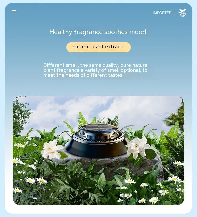 Black solar-powered car air freshener with rotating double rings on car dashboard