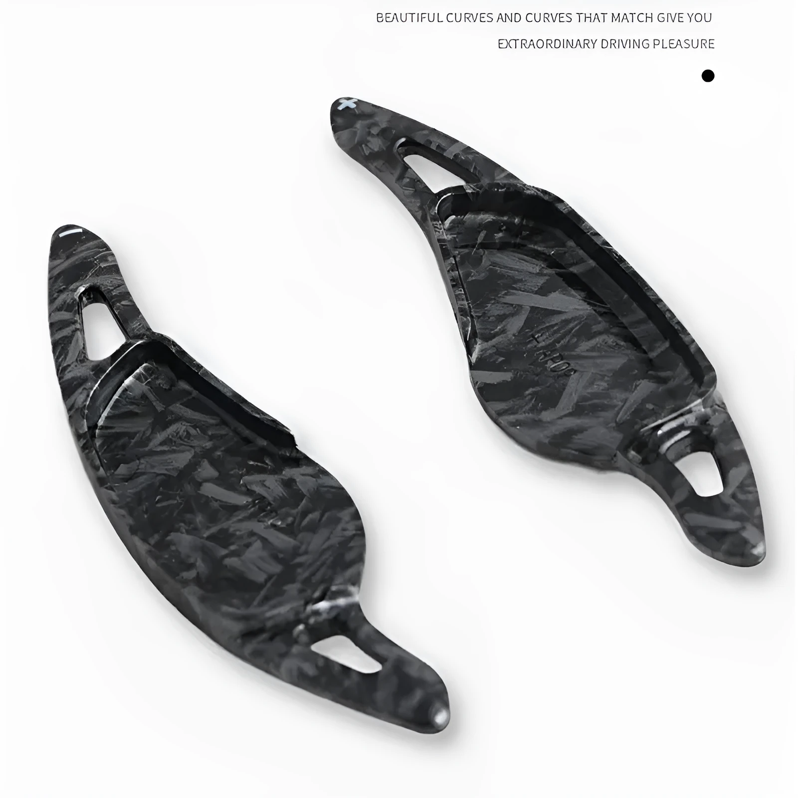 Steering wheel paddle shifters in carbon fibre black finish for manual gear control enhancement