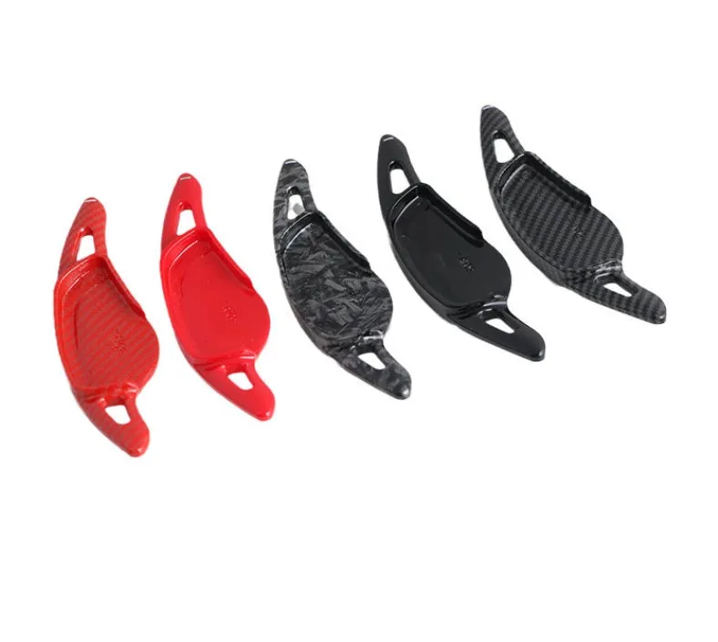Steering wheel paddle shifters in carbon fibre black finish for manual gear control enhancement