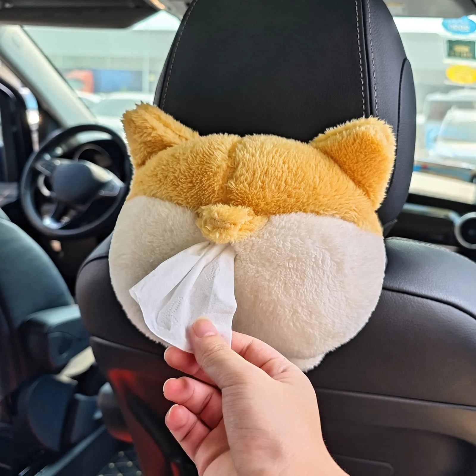 Soft yellow corgi butt-shaped tissue box cover with elastic strap for car sun visor.