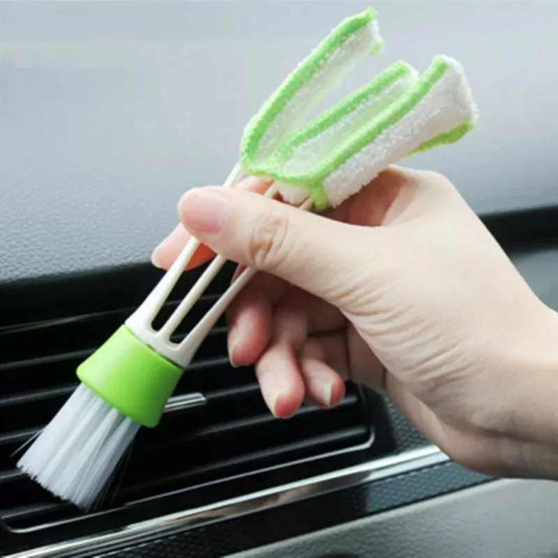 Round head car washing brush with pig bristles and wooden handle on a workbench