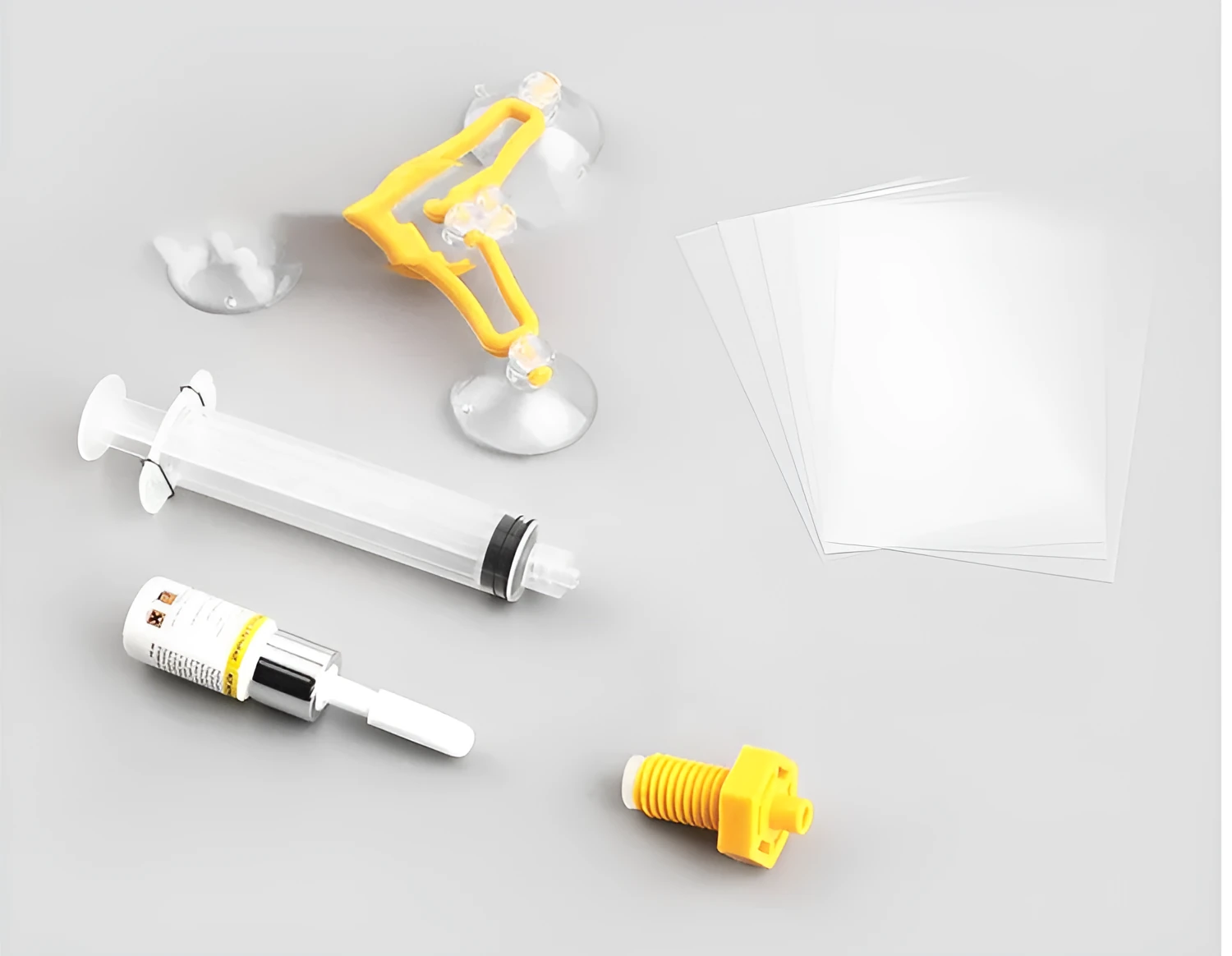 Yellow plastic triangle bracket auto glass repair tool with 2ml fluid for windshield chips and scratches