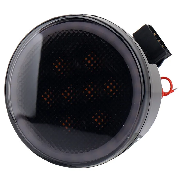 Pair of yellow LED turn signal lights mounted in Jeep Wrangler JK centre grille with ABS polymer housing