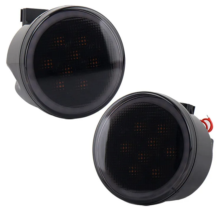 Pair of yellow LED turn signal lights mounted in Jeep Wrangler JK centre grille with ABS polymer housing