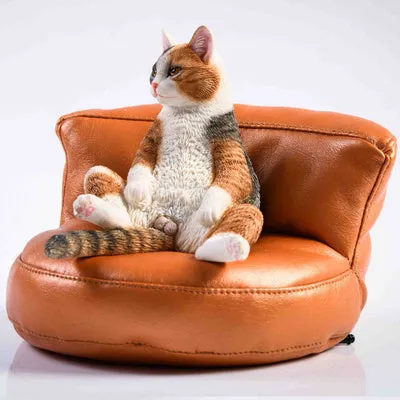 Small lazy cat car ornament with fabric sofa, 75mm high dashboard decoration.