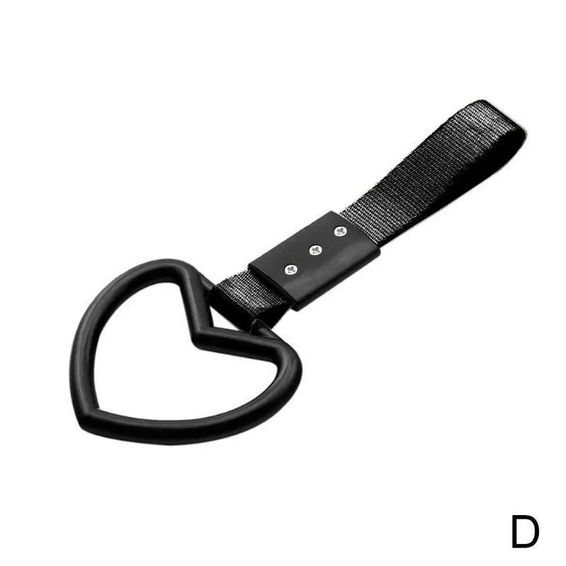 Heart-shaped car warning ring in black red colour made from nylon braid and plastic on rear bumper