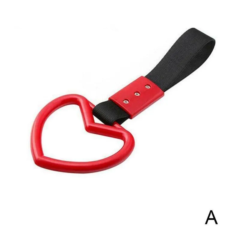 Heart-shaped car warning ring in black red colour made from nylon braid and plastic on rear bumper