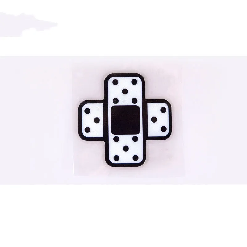 White cross reflective PVC car body sticker on a vehicle exterior panel
