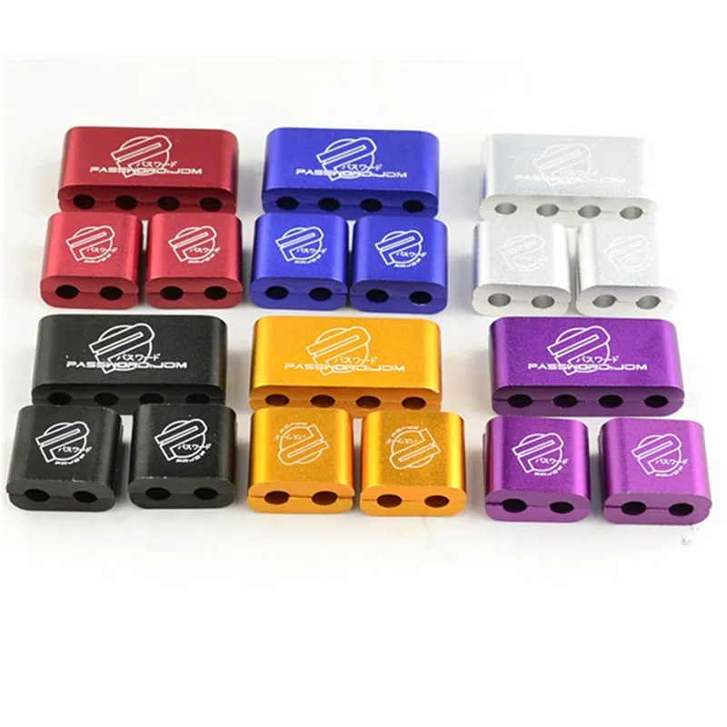 Set of three metal car modification fastening clamps with a fixed sleeve in assorted colours.