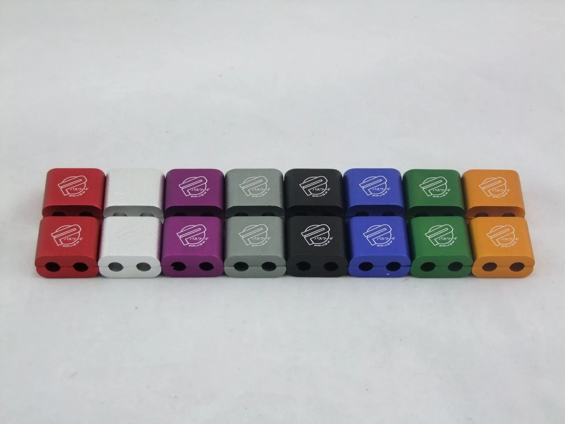 Set of three metal car modification fastening clamps with a fixed sleeve in assorted colours.