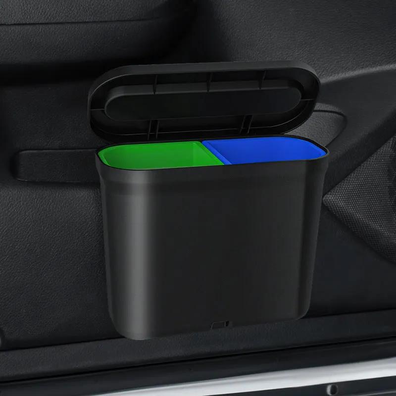 Black 1.7L PP plastic car trash can suspended on centre console with lid open, interior visible