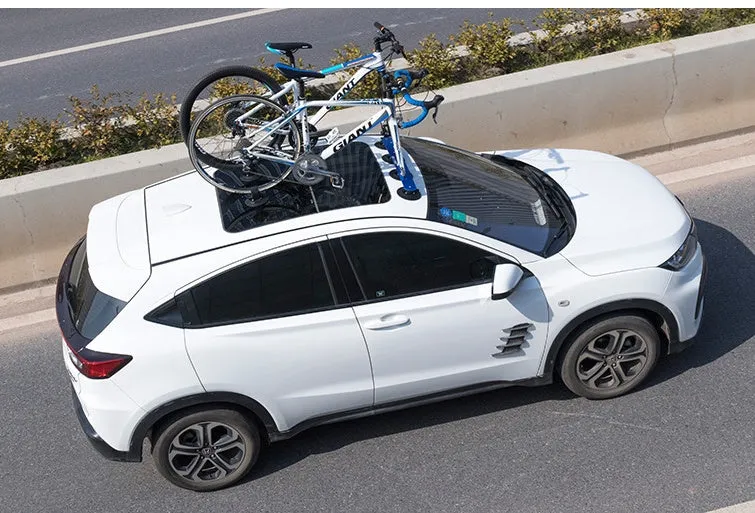 Bicycle vacuum adsorption roof rack made of aluminium alloy and rubber in red colour on a car roof