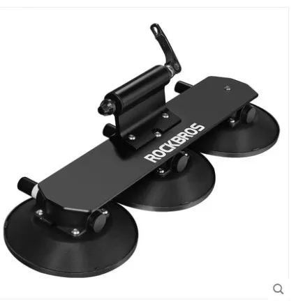 Bicycle vacuum adsorption roof rack made of aluminium alloy and rubber in red colour on a car roof