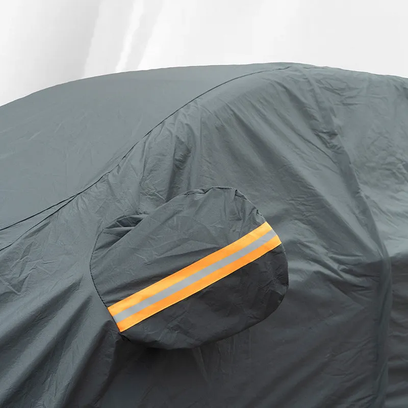 Grey PVC car cover for Volkswagen models shown fitted on a car, illustrating rainproof and sun protection design.