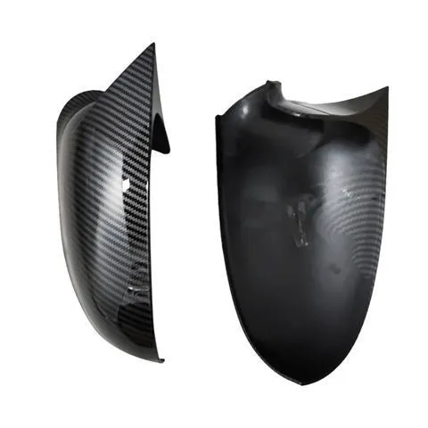 Bright black plastic mirror reflector shell pair for a Volkswagen Sagitar car.