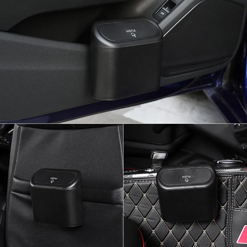 Black ABS car trash can with upturned lid and removable hook, 160x143x85mm, on car seat