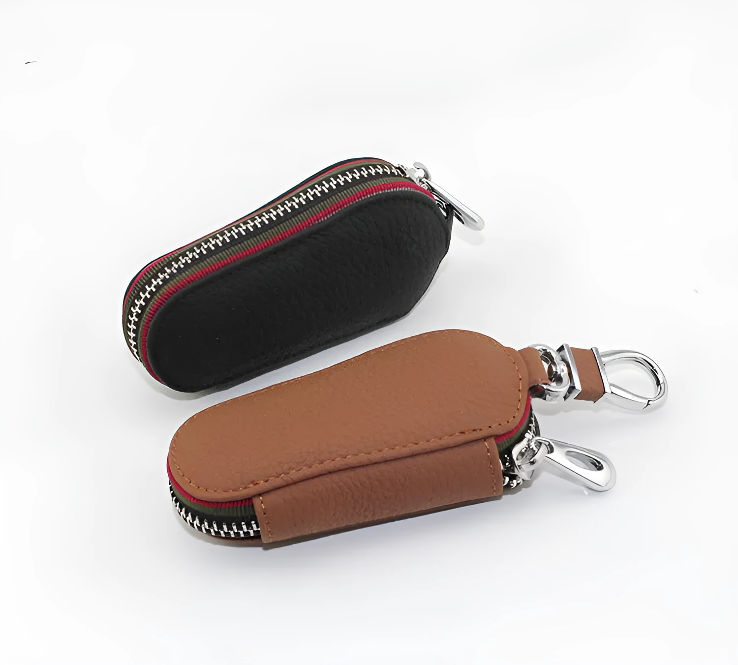 Brown leather car universal key case holding a car key on a white background