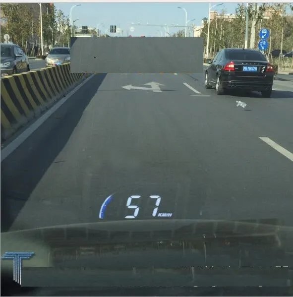 A101 OBD2 universal head-up display with 3-inch LED screen in black, mounted on car dashboard with speed and temperature projection