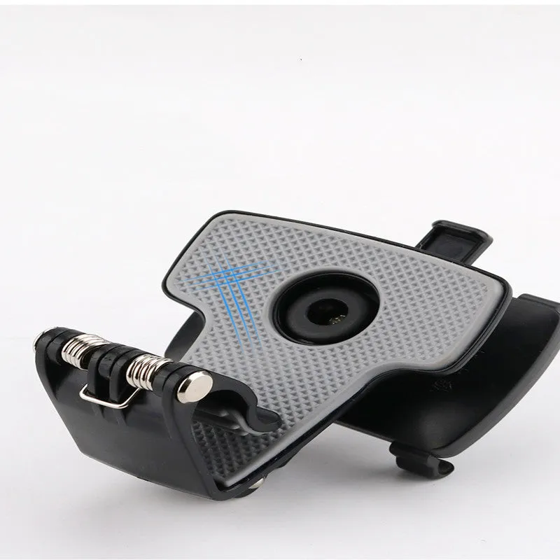 Black car phone holder mounted on dashboard with smartphone in clip