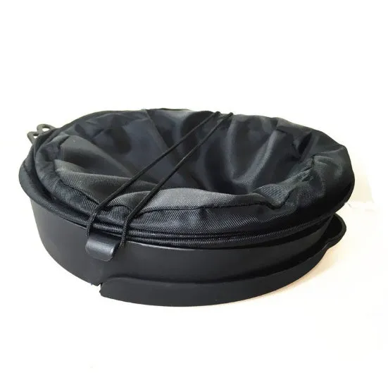 Black cylindrical foldable car trash bin 16x20.5cm with adjustable strap for vehicle cleaning and storage on a seat