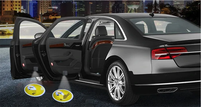 Two black wireless car LED welcome door projection laser lights showing a 3D logo projected onto the ground