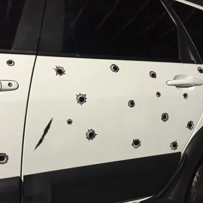 Car scratch simulation bullet hole crack vinyl sticker 21x30cm with four hole pattern styles on a car bumper