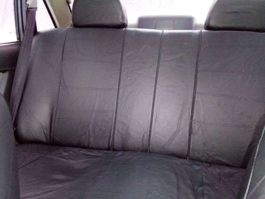 Car leather seat cover set 9-piece with installation hooks and English manual on vehicle seat
