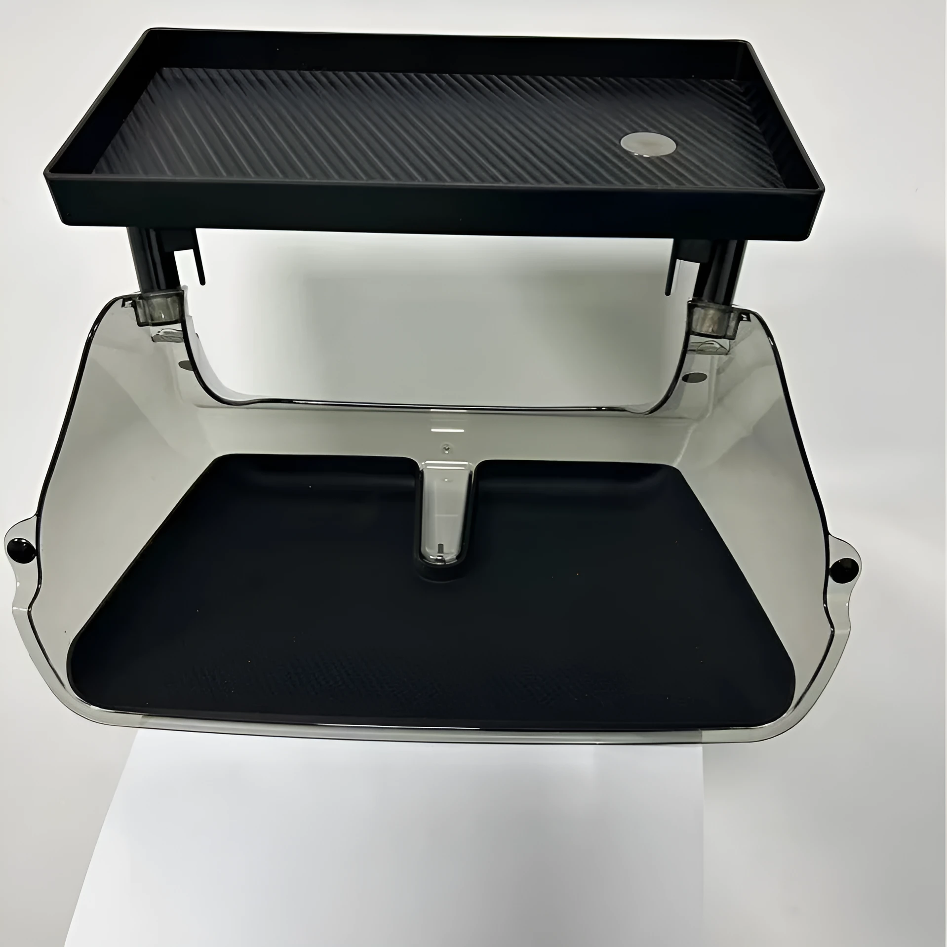 Black ABS plastic storage box fitted under the touchscreen of a Tesla Model Y interior.