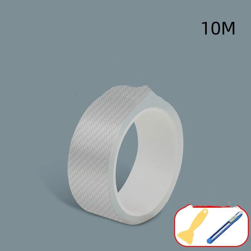 Roll of transparent carbon fibre grain anti-collision strip for car protection with scraper and utility knife.