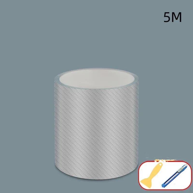 Roll of transparent carbon fibre grain anti-collision strip for car protection with scraper and utility knife.