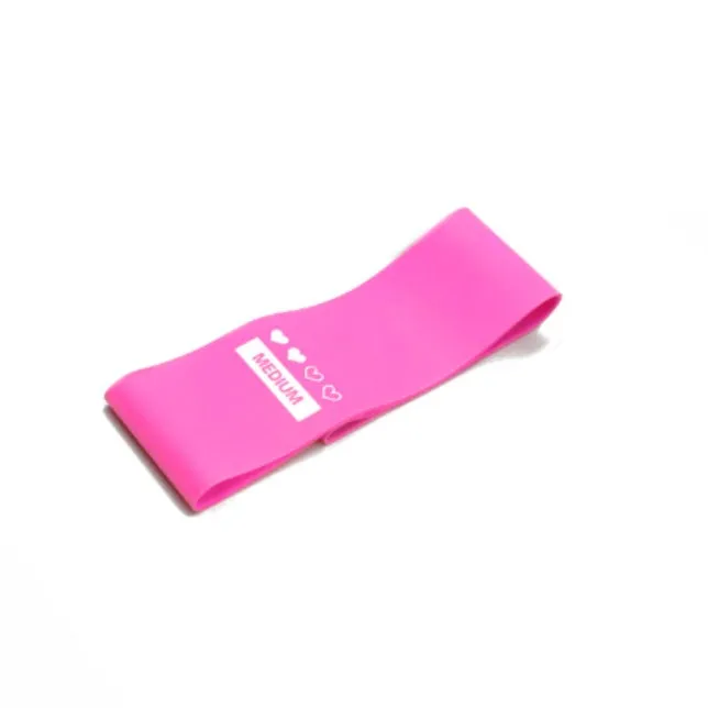 Four colour-coded resistance bands in purple, pink, blue, and grey with non-slip inner lines laid flat on a surface