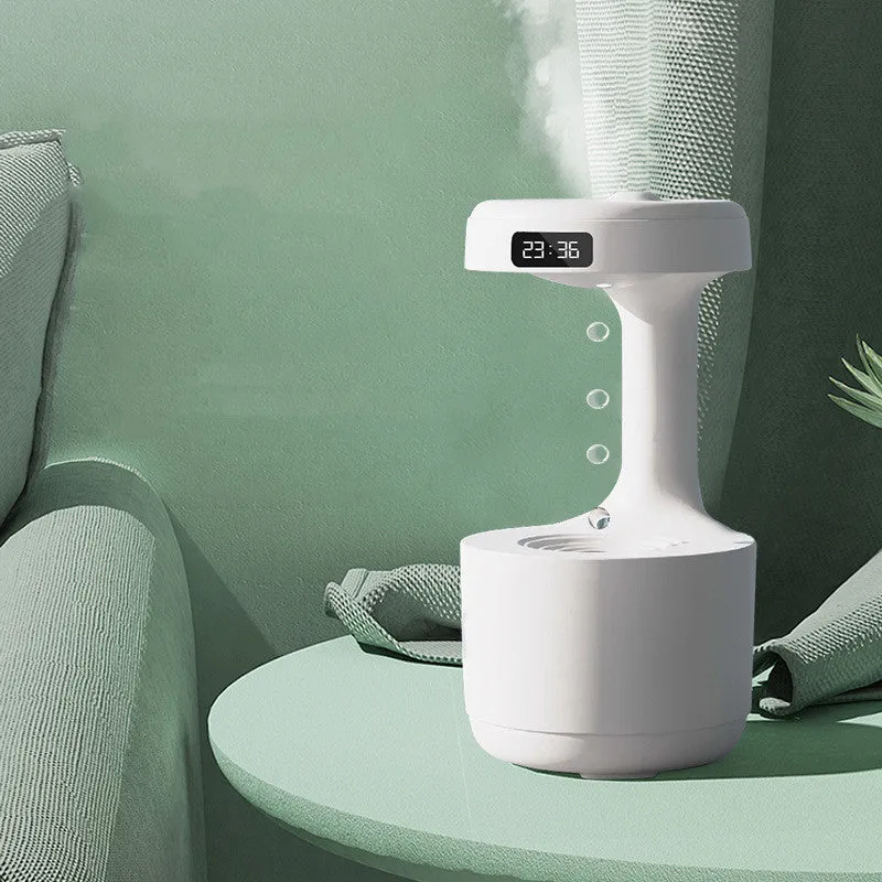 Bedroom anti-gravity humidifier with clock and backflow aroma diffuser in white plastic on desk with LED display