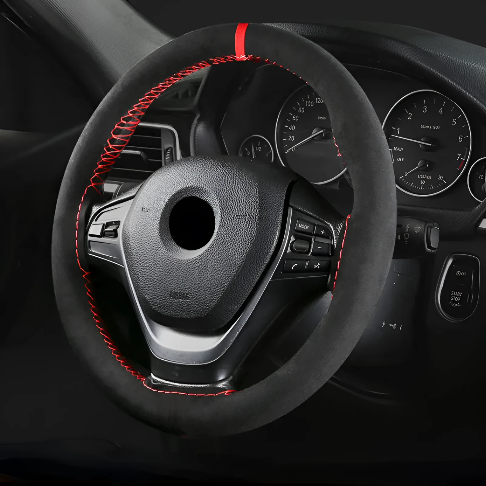 Black microfiber steering wheel cover with contrasting red stitch on 38cm diameter wheel