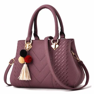 Ladies handbag in PU leather with zipper closure, available in multiple colours, shown as a crossbody style with internal compartments