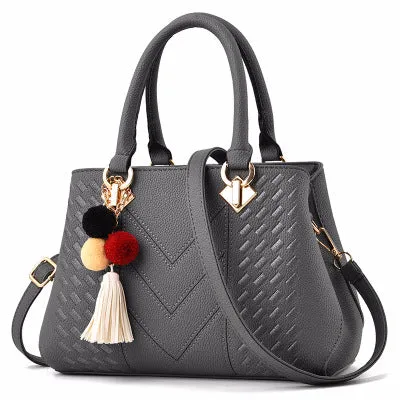 Ladies handbag in PU leather with zipper closure, available in multiple colours, shown as a crossbody style with internal compartments