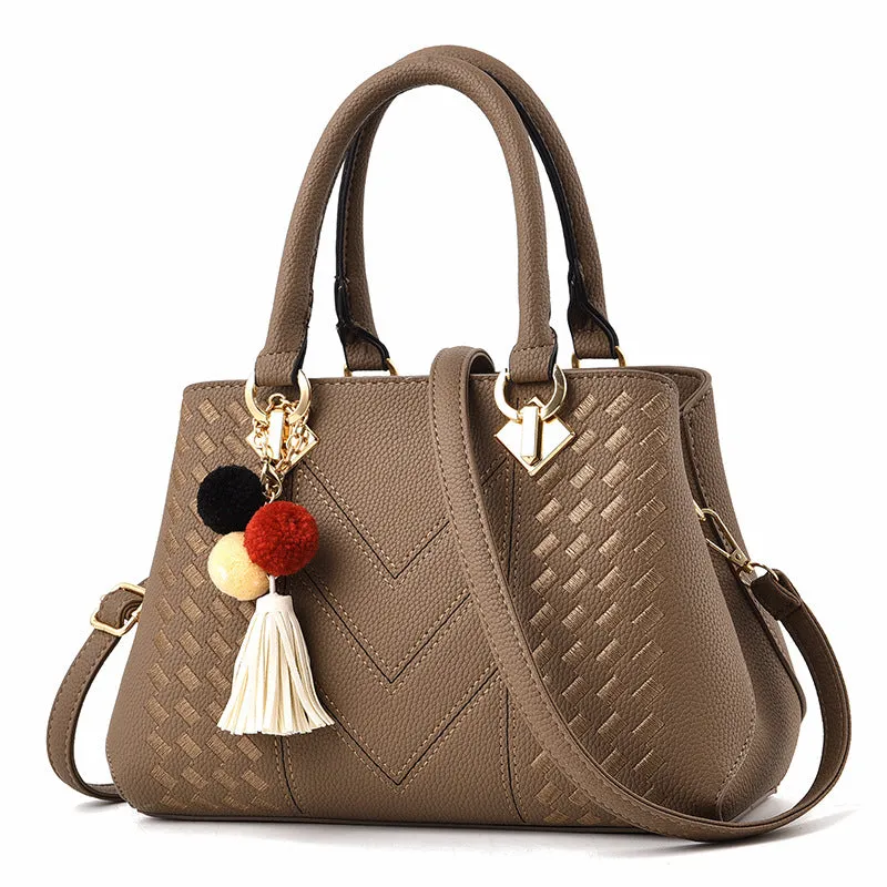 Ladies handbag in PU leather with zipper closure, available in multiple colours, shown as a crossbody style with internal compartments