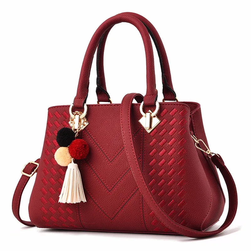 Ladies handbag in PU leather with zipper closure, available in multiple colours, shown as a crossbody style with internal compartments
