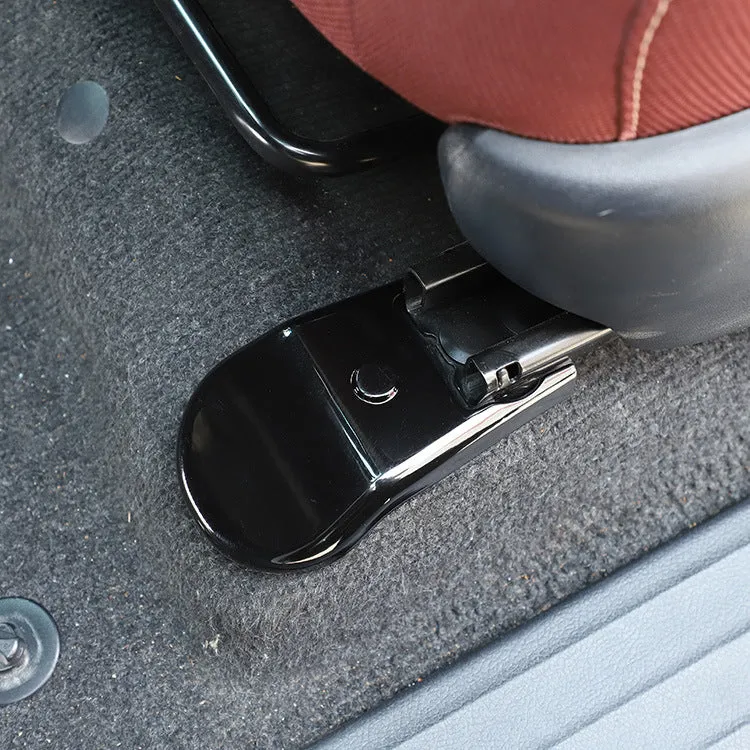 Black plastic seat feet screw decoration covers for 15-21 Toyota Hi Lux, 4 piece set on a white background