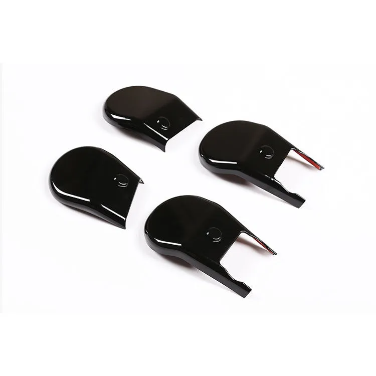 Black plastic seat feet screw decoration covers for 15-21 Toyota Hi Lux, 4 piece set on a white background