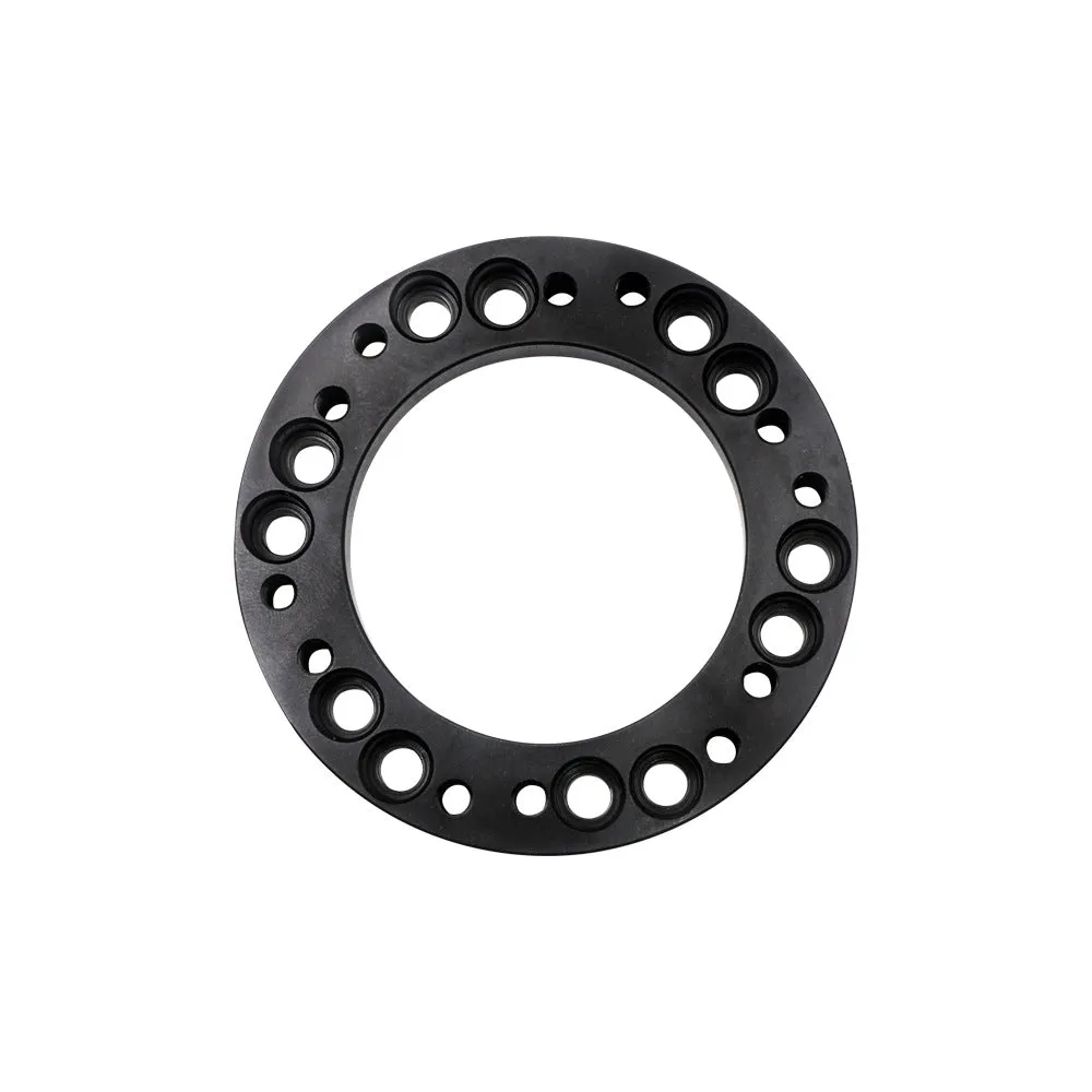 Steering wheel hub adapter in aluminium alloy with 86mm outer diameter, 55mm inner diameter, 12.5mm height, on white background