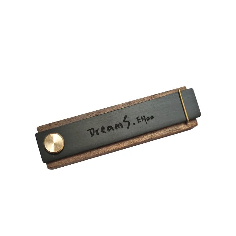 Customisable car perfume ornament diffuser with wood body and brass clip on a car air vent