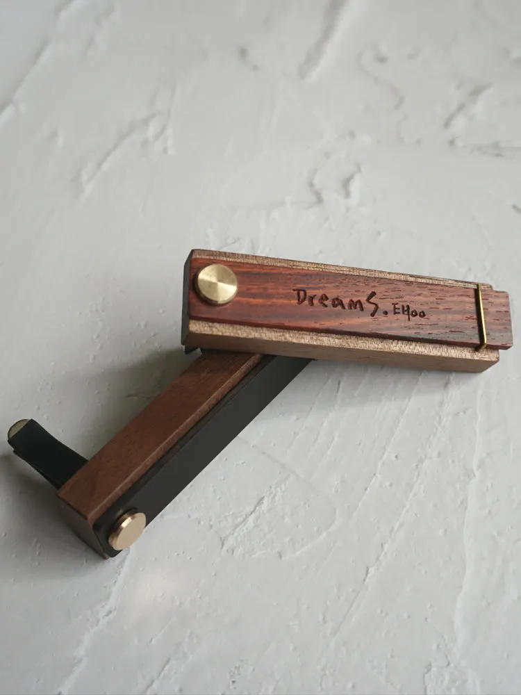 Customisable car perfume ornament diffuser with wood body and brass clip on a car air vent