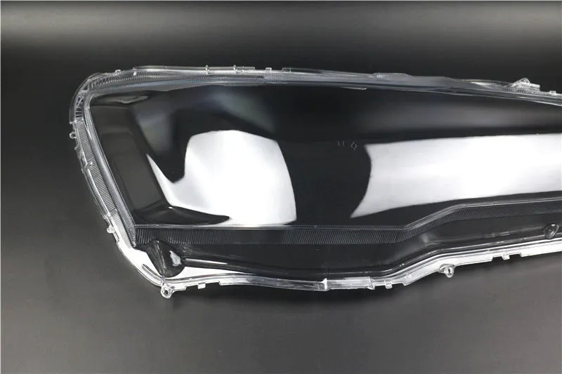 Transparent plastic car headlight housing cover showing 50mm by 30mm dimensions